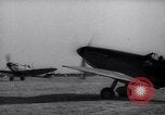 Image of British ground crewman assist RAF pilots of Spitfire fighter planes England United Kingdom, 1940, second 49 stock footage video 65675041005