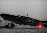 Image of British ground crewman assist RAF pilots of Spitfire fighter planes England United Kingdom, 1940, second 53 stock footage video 65675041005