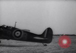 Image of British ground crewman assist RAF pilots of Spitfire fighter planes England United Kingdom, 1940, second 54 stock footage video 65675041005