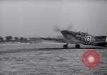 Image of British ground crewman assist RAF pilots of Spitfire fighter planes England United Kingdom, 1940, second 57 stock footage video 65675041005
