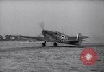 Image of British ground crewman assist RAF pilots of Spitfire fighter planes England United Kingdom, 1940, second 58 stock footage video 65675041005