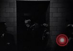 Image of Accused men with covered faces New York City USA, 1951, second 26 stock footage video 65675041144