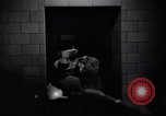 Image of Accused men with covered faces New York City USA, 1951, second 27 stock footage video 65675041144