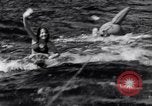 Image of surfing Venice Beach Los Angeles California USA, 1935, second 28 stock footage video 65675041280