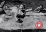 Image of surfing Venice Beach Los Angeles California USA, 1935, second 32 stock footage video 65675041280