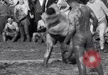 Immagine di Il fango wrestling Los Angeles California USA, 1936, secondo 17 filmato di repertorio 65675041292