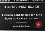 Image of pier blaze Alameda California USA, 1929, second 10 stock footage video 65675041387
