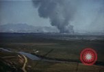 Image of burning village Korea, 1950, second 4 stock footage video 65675041558
