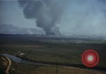 Image of burning village Korea, 1950, second 7 stock footage video 65675041558