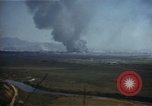 Image of burning village Korea, 1950, second 8 stock footage video 65675041558