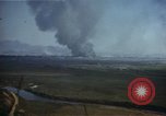 Image of burning village Korea, 1950, second 9 stock footage video 65675041558