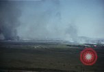 Image of burning village Korea, 1950, second 11 stock footage video 65675041558
