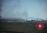 Image of burning village Korea, 1950, second 13 stock footage video 65675041558