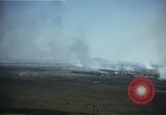Image of burning village Korea, 1950, second 14 stock footage video 65675041558