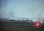 Image of burning village Korea, 1950, second 16 stock footage video 65675041558