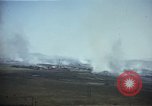 Image of burning village Korea, 1950, second 18 stock footage video 65675041558
