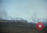 Image of burning village Korea, 1950, second 19 stock footage video 65675041558