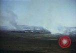 Image of burning village Korea, 1950, second 20 stock footage video 65675041558