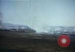 Image of burning village Korea, 1950, second 21 stock footage video 65675041558