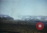 Image of burning village Korea, 1950, second 23 stock footage video 65675041558