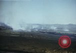 Image of burning village Korea, 1950, second 24 stock footage video 65675041558
