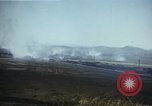 Image of burning village Korea, 1950, second 25 stock footage video 65675041558
