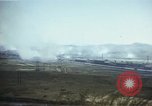 Image of burning village Korea, 1950, second 26 stock footage video 65675041558