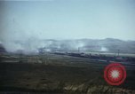 Image of burning village Korea, 1950, second 27 stock footage video 65675041558