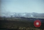 Image of burning village Korea, 1950, second 28 stock footage video 65675041558