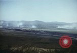 Image of burning village Korea, 1950, second 30 stock footage video 65675041558