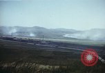 Image of burning village Korea, 1950, second 31 stock footage video 65675041558