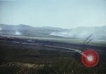 Image of burning village Korea, 1950, second 32 stock footage video 65675041558