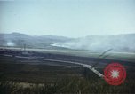 Image of burning village Korea, 1950, second 33 stock footage video 65675041558
