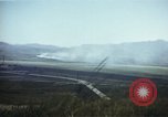 Image of burning village Korea, 1950, second 34 stock footage video 65675041558