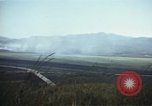 Image of burning village Korea, 1950, second 36 stock footage video 65675041558