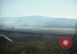 Image of burning village Korea, 1950, second 37 stock footage video 65675041558