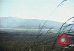 Image of burning village Korea, 1950, second 40 stock footage video 65675041558