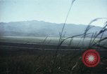 Image of burning village Korea, 1950, second 41 stock footage video 65675041558