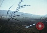 Image of burning village Korea, 1950, second 45 stock footage video 65675041558