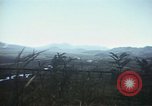 Image of burning village Korea, 1950, second 50 stock footage video 65675041558