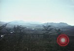 Image of burning village Korea, 1950, second 52 stock footage video 65675041558