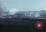 Image of burning village Korea, 1950, second 54 stock footage video 65675041558