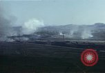 Image of burning village Korea, 1950, second 55 stock footage video 65675041558