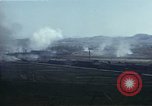 Image of burning village Korea, 1950, second 57 stock footage video 65675041558