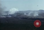 Image of burning village Korea, 1950, second 59 stock footage video 65675041558