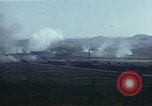 Image of burning village Korea, 1950, second 60 stock footage video 65675041558