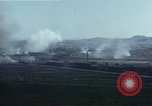 Image of burning village Korea, 1950, second 61 stock footage video 65675041558