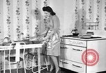 Image of housewife in 1930s United States USA, 1938, second 1 stock footage video 65675041917