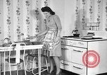 Image of housewife in 1930s United States USA, 1938, second 9 stock footage video 65675041917