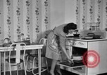 Image of housewife in 1930s United States USA, 1938, second 36 stock footage video 65675041917